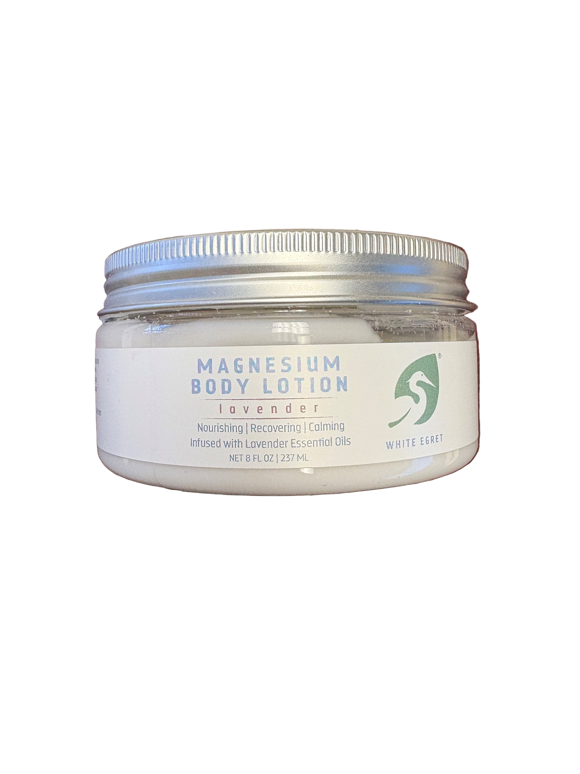 Jar of magnesium body lotion with a visible brand logo on a dark background