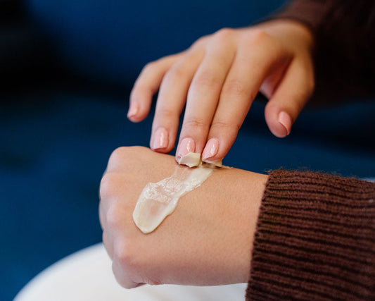 adding creme to hands