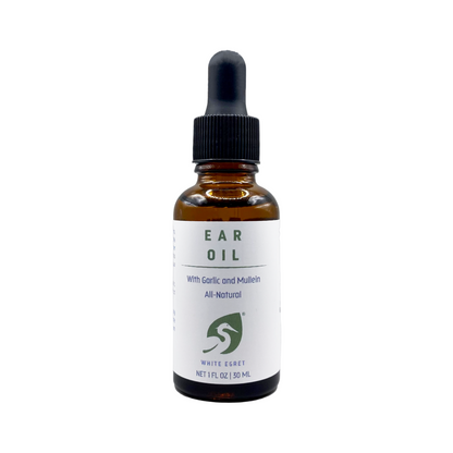 Bottle of ear oil with a dropper on a white background