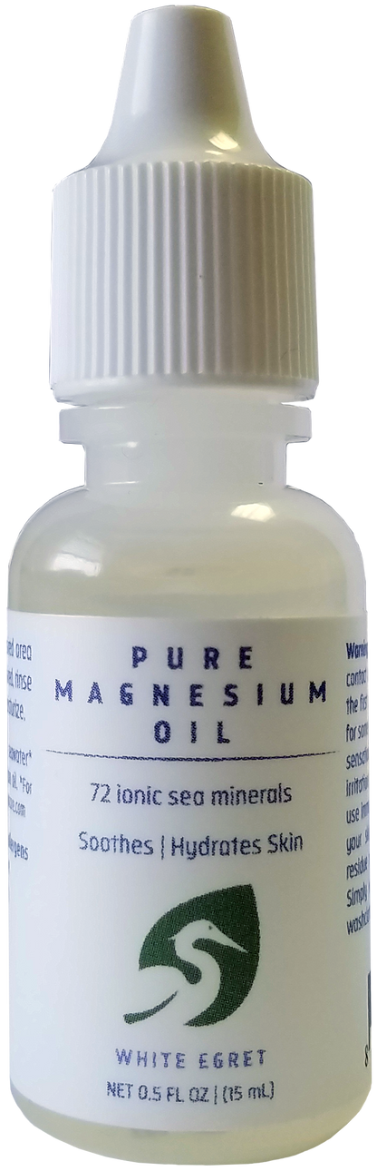 Bottle of Pure Magnesium Oil with a white cap on a white background