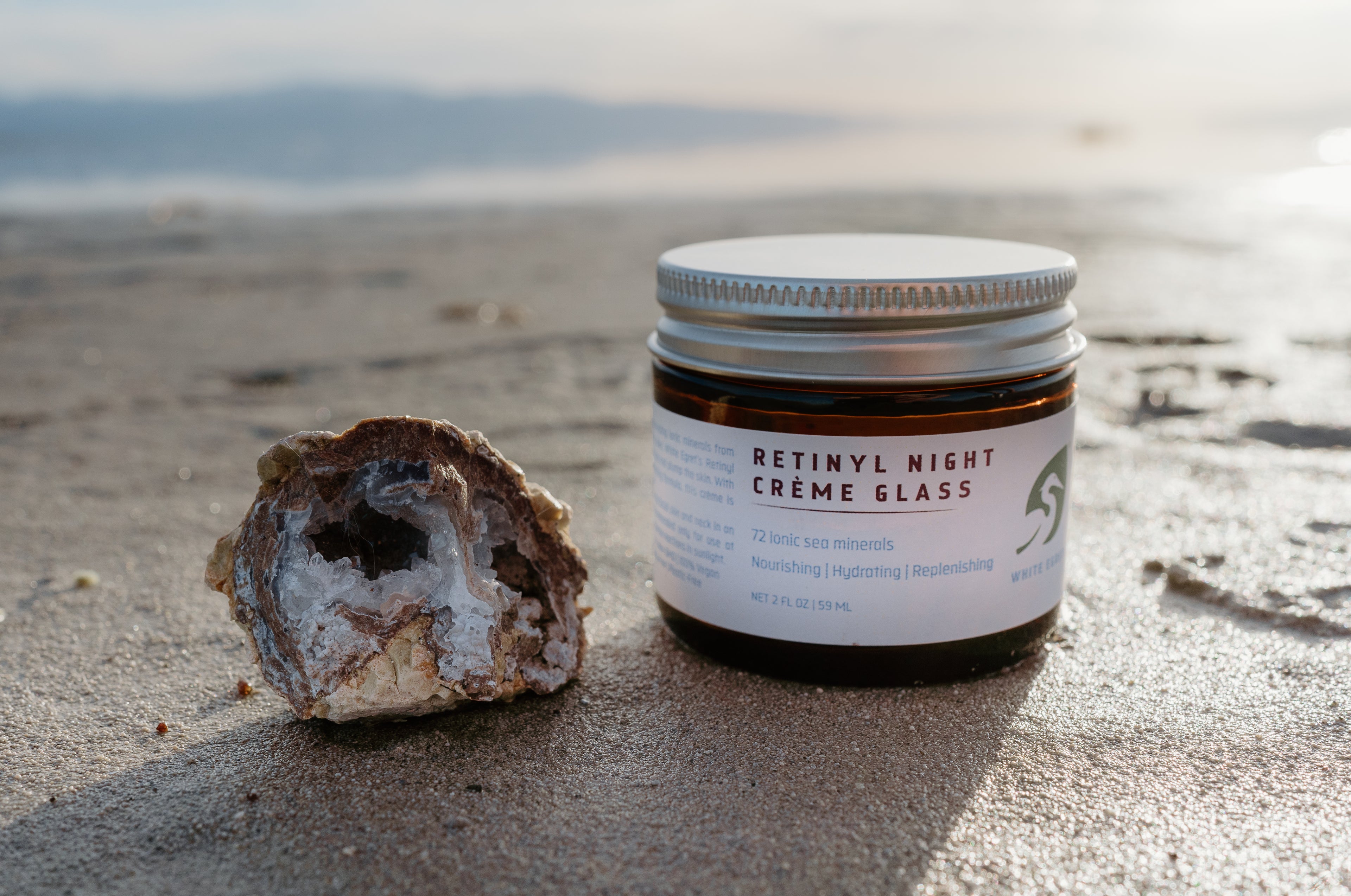 retinyl night cream in a glass jar next to a geode at saltair in utah great salt lake mineral skin care